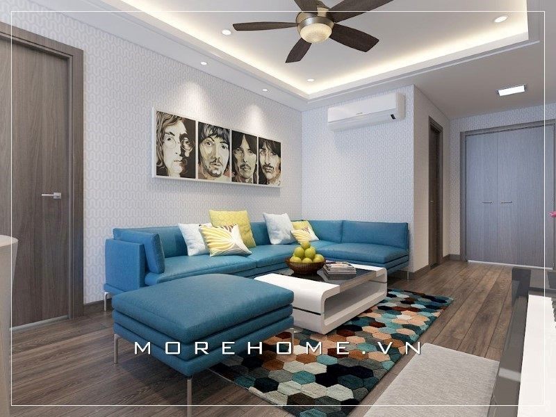 Ghế sofa màu xanh đó làm cho không gian phòng khách trở nên thân thiện và ấn tượng hơn bởi nó là điểm nhấn.